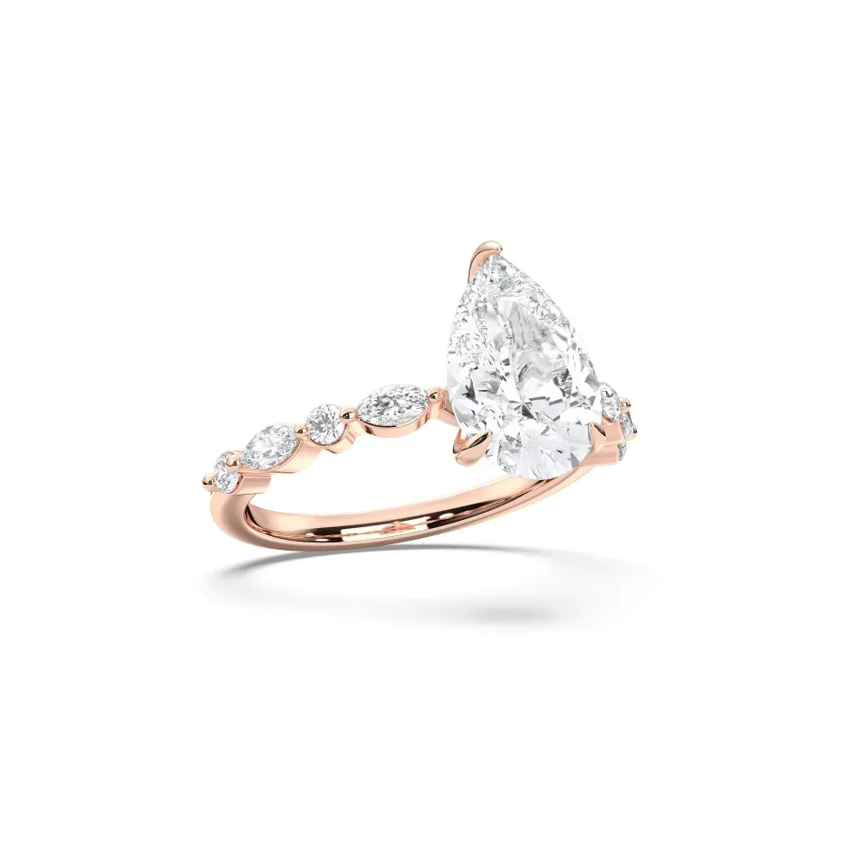 Rose gold Pear Cut Engagement Ring With Mq/rd Side Stone