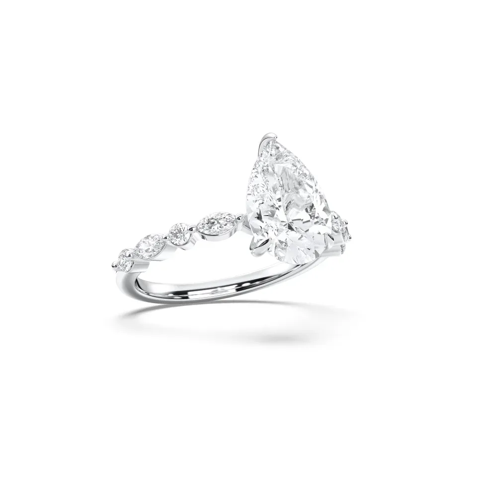 White gold Pear Cut Engagement Ring With Mq/rd Side Stone